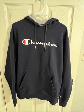 Champion Navy Hoodie with Script Logo and Red Accent
